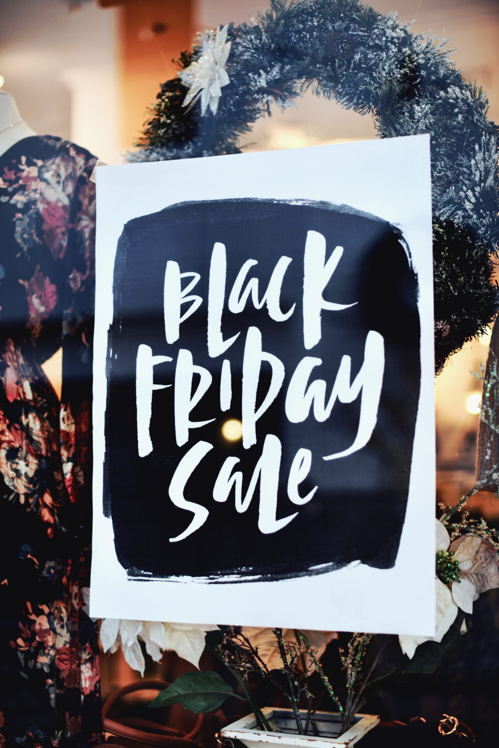 A photo by Tim Mossholder of a sign that reads Black Friday Sale in a shop window.