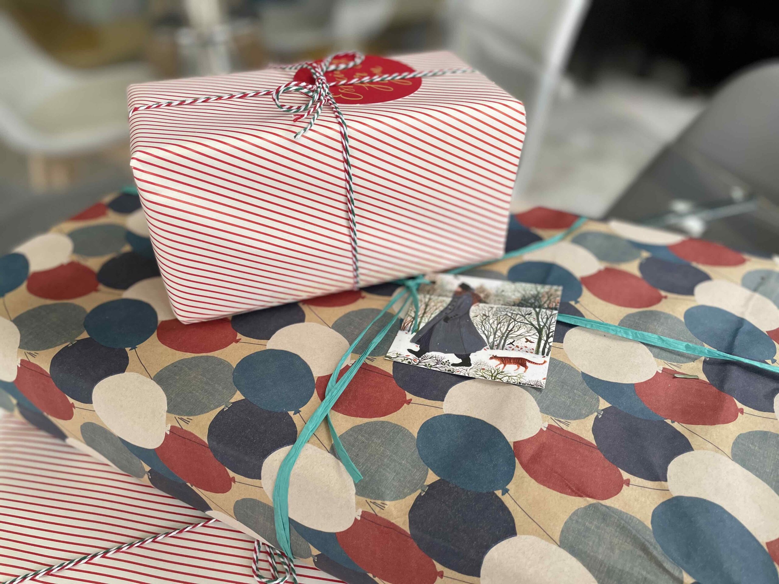 A photo of some Christmas Presents piled up with no plastic packaging.